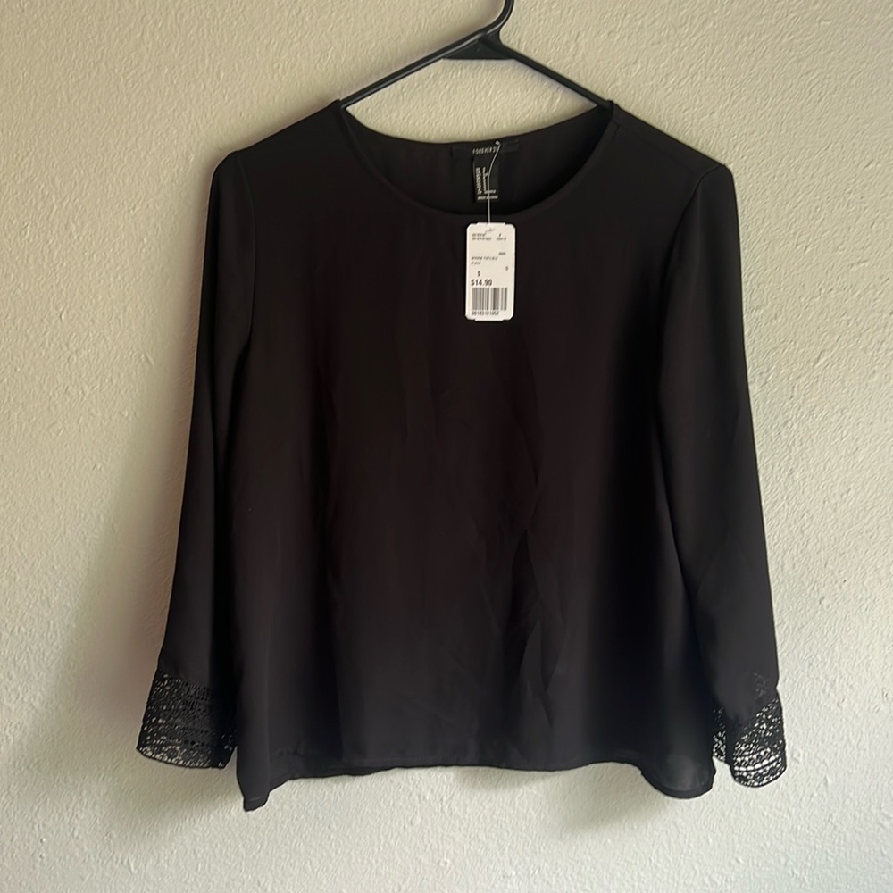 Tags on, small forever 21 black blouse never worn